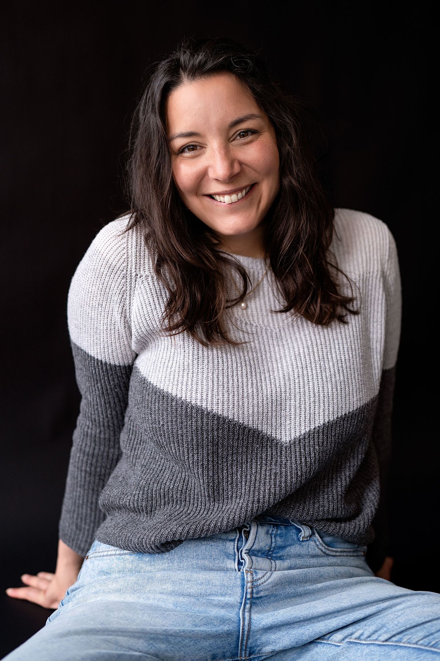 Mercedes Jones, family, engagement, graduation, and portrait photographer posing for a headshot.