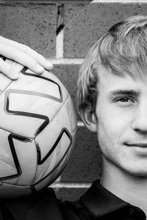 Creative black and white portrait series with soccer ball creating unique visual effects.