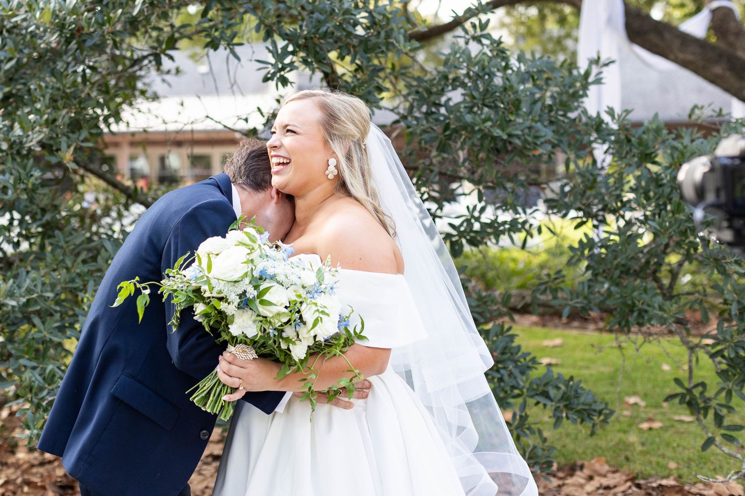 groom kisses brides neck