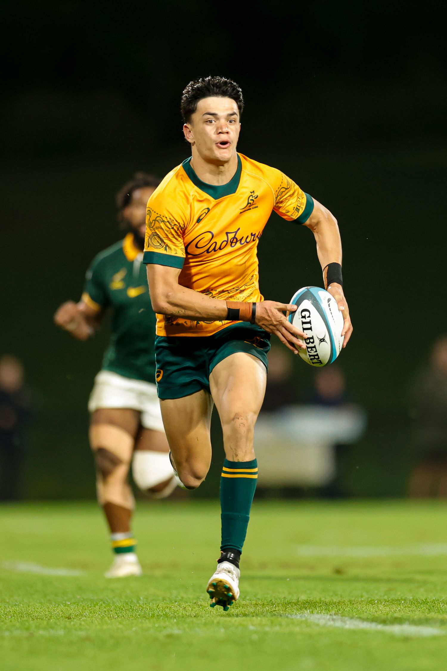 U20 Australian Rugby player running down the field in picture shot by sunshine coast sports photographer