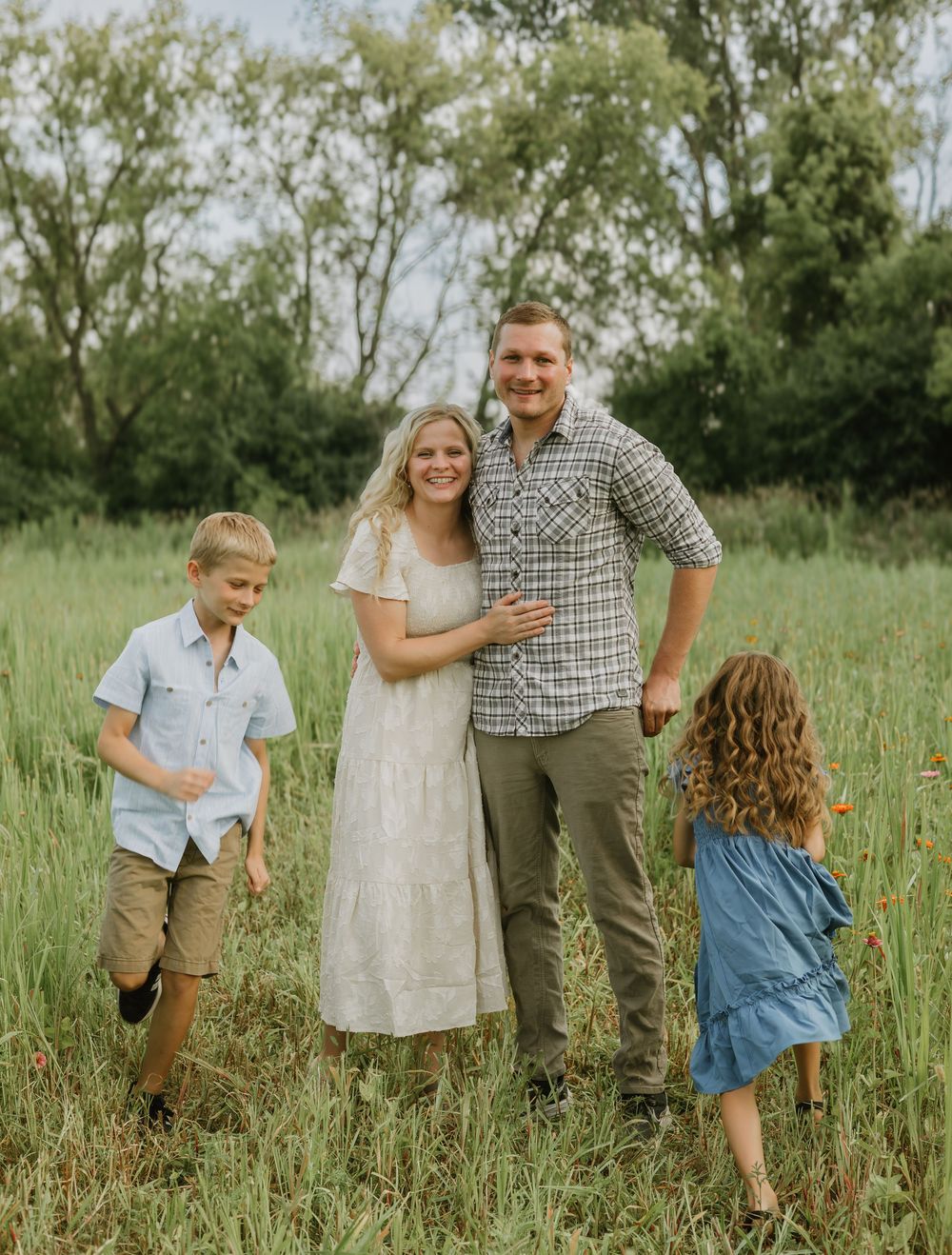 family in wildflower field