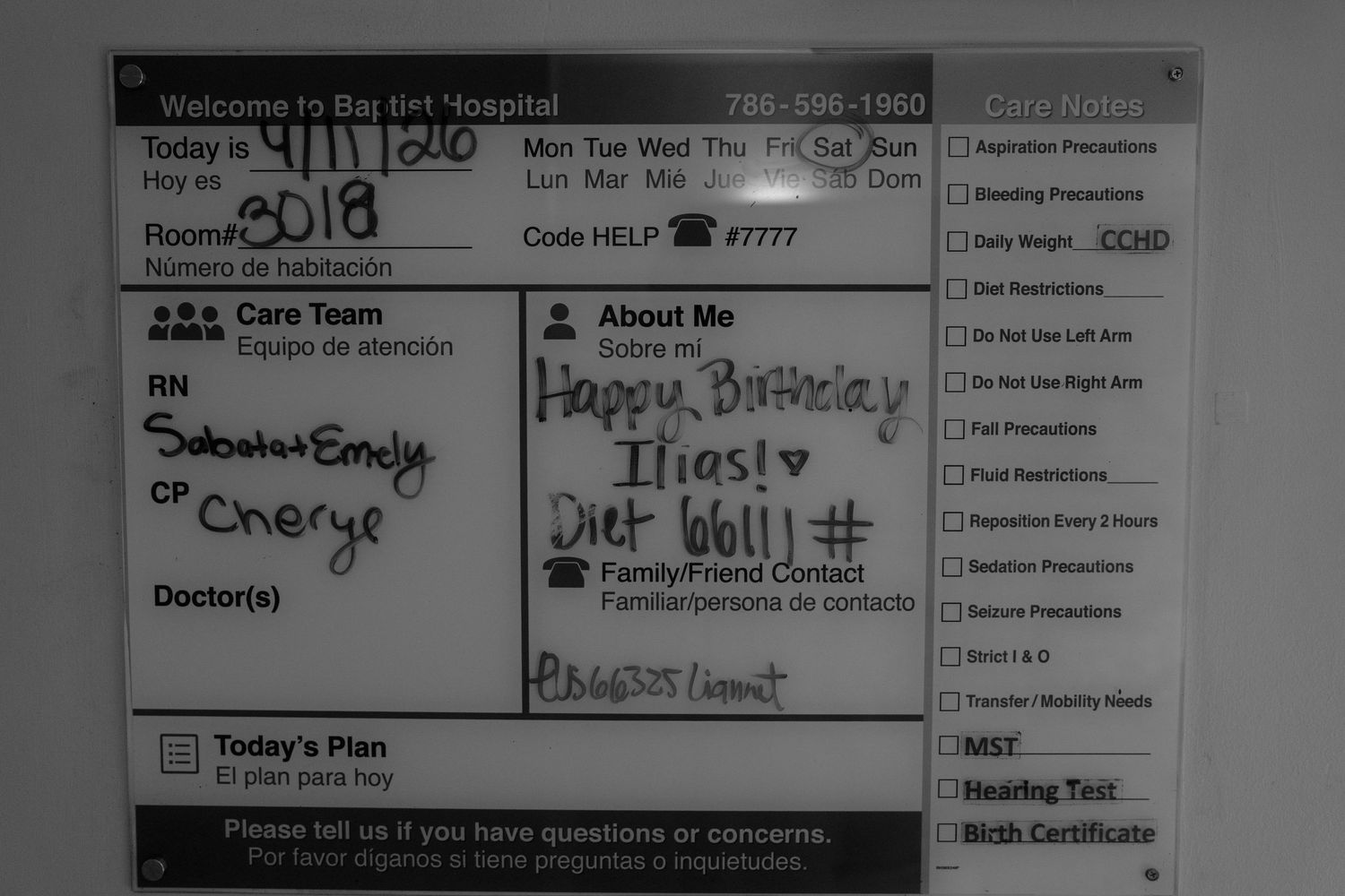 Hospital whiteboard showing birthday message for patient Ilias, with care team names and daily plan noted.