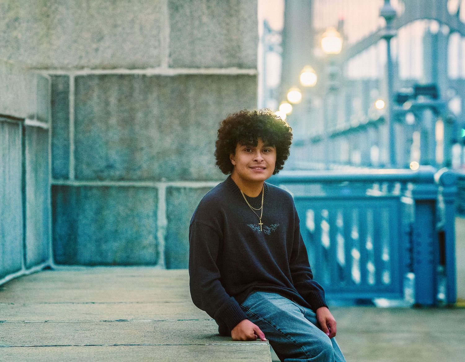 teen boy on ben franklin bridge in philadelphia for senior session