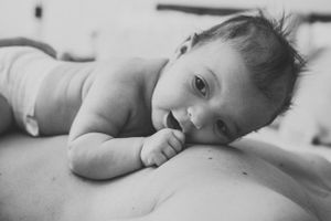 Black and white image of peaceful skin-to-skin contact.