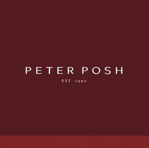 Deep burgundy colored background with elegantly positioned PETER POSH logo and Est. 1990 text in silver lettering.