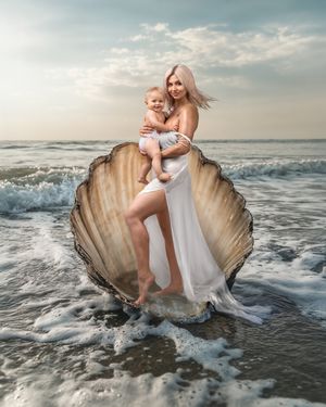 Mother and daughter standing in a giant seashell in an ocean scene, Caz Captures, Sydney photography studio.