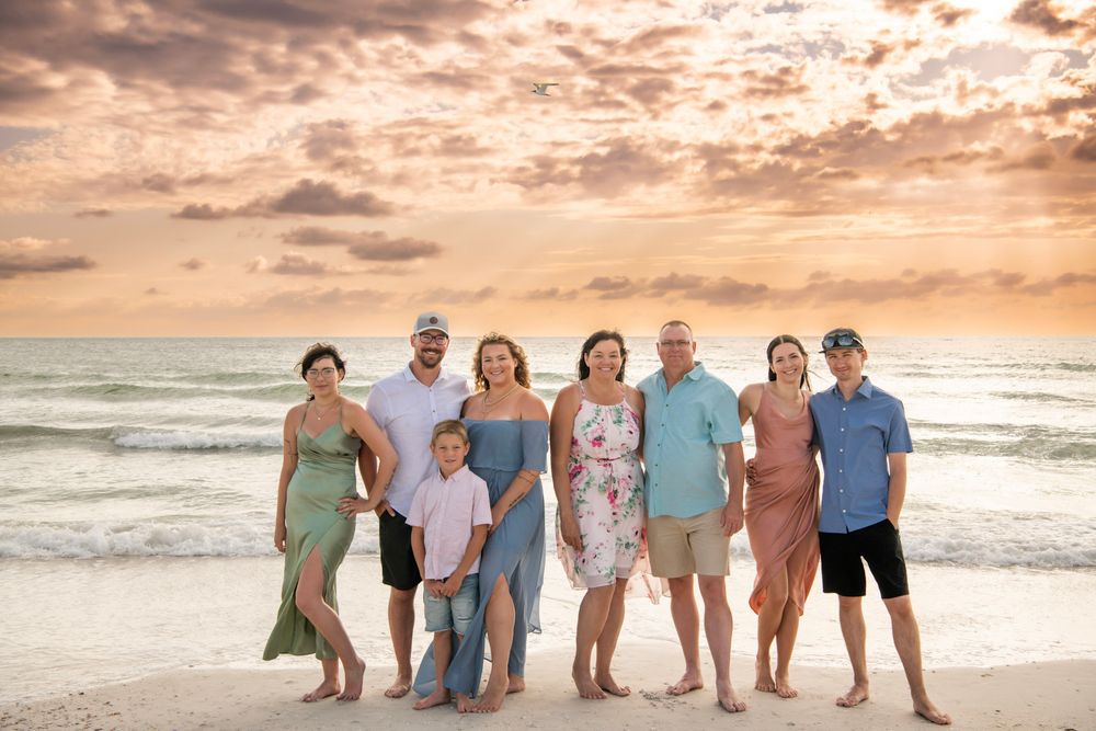 Family vacation portrait at sunset in Dunedin, Florida, capturing multiple generations together on the Gulf Coast beach.
