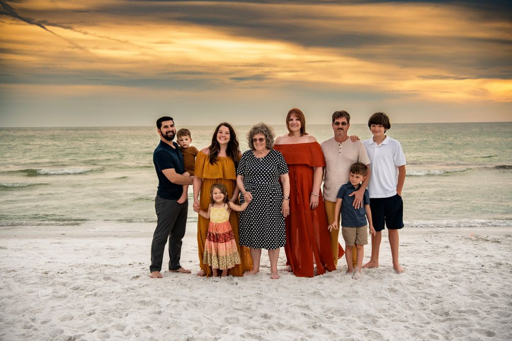 Multi-generational family portrait on Madeira Beach, Florida, featuring grandparents, parents, and children.