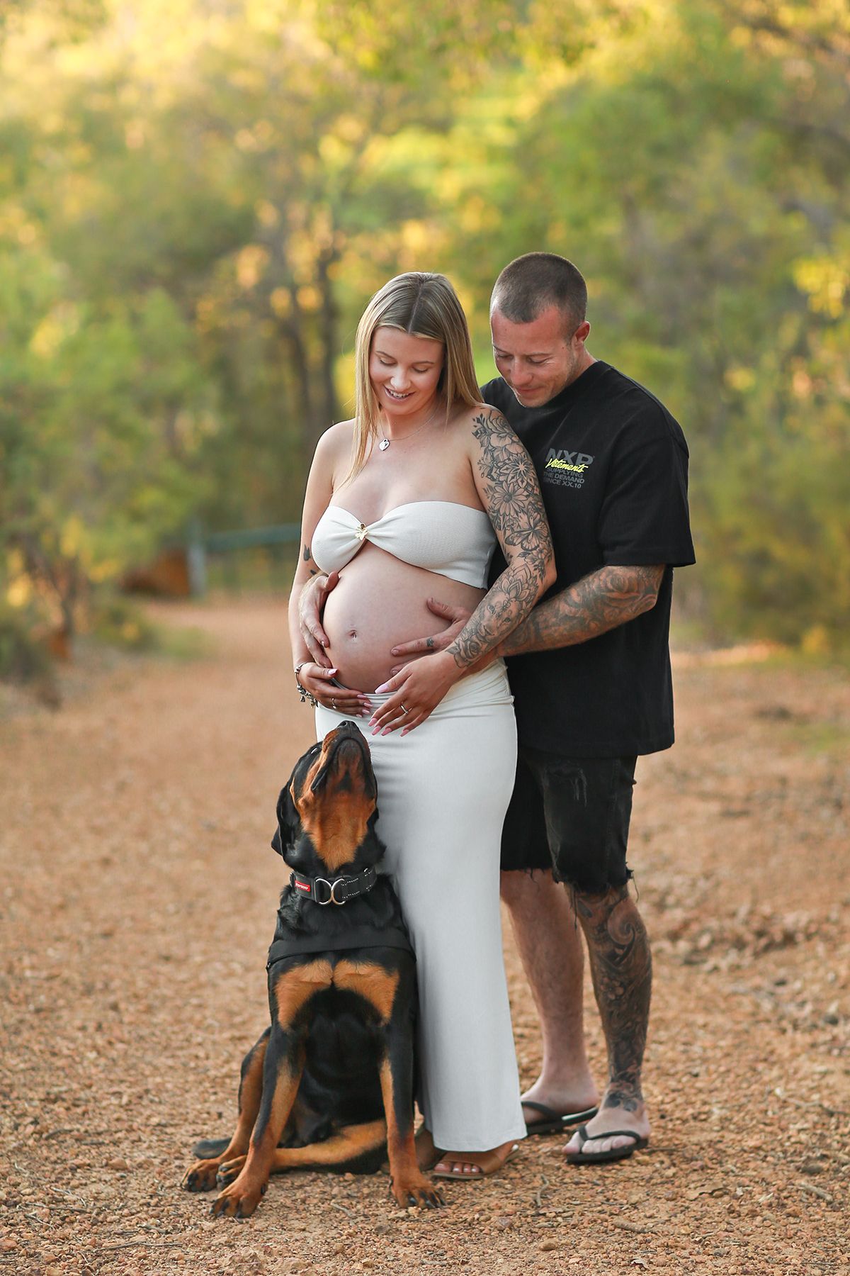 Couple and Rottweiler during a maternity session in Perth