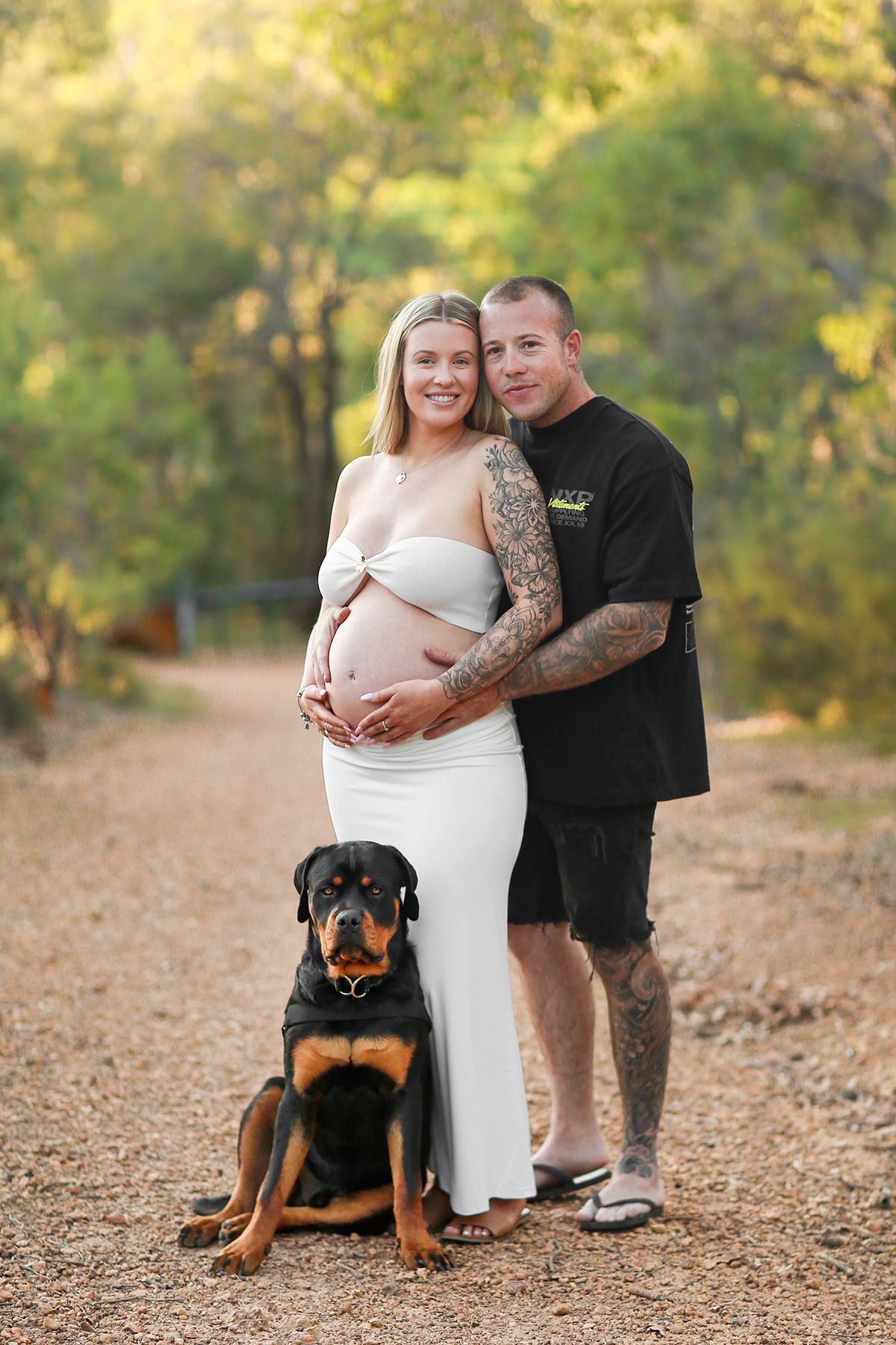 Couple and Rottweiler during a maternity session in Perth