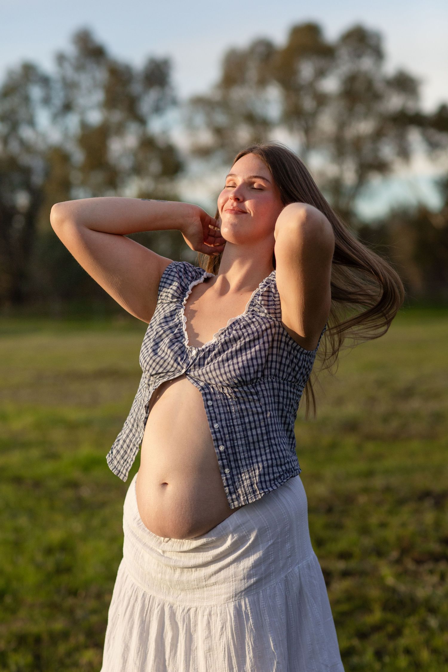 Mum to be in golden hour during a maternity session in Perth