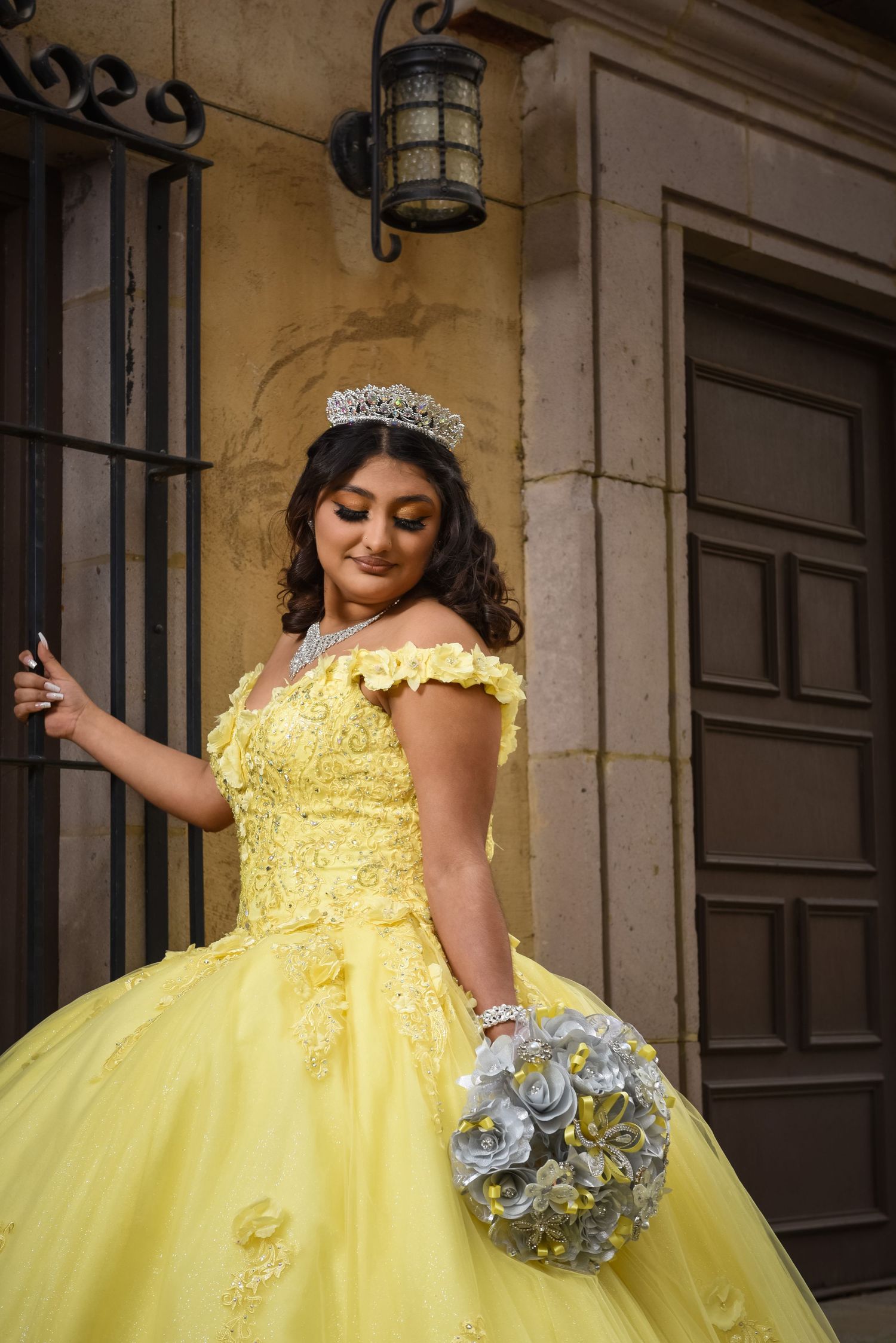 Irving Texas Quinceañera portrait session highlighting Briana's elegant yellow gown at beautiful Las Colinas Canals location today.