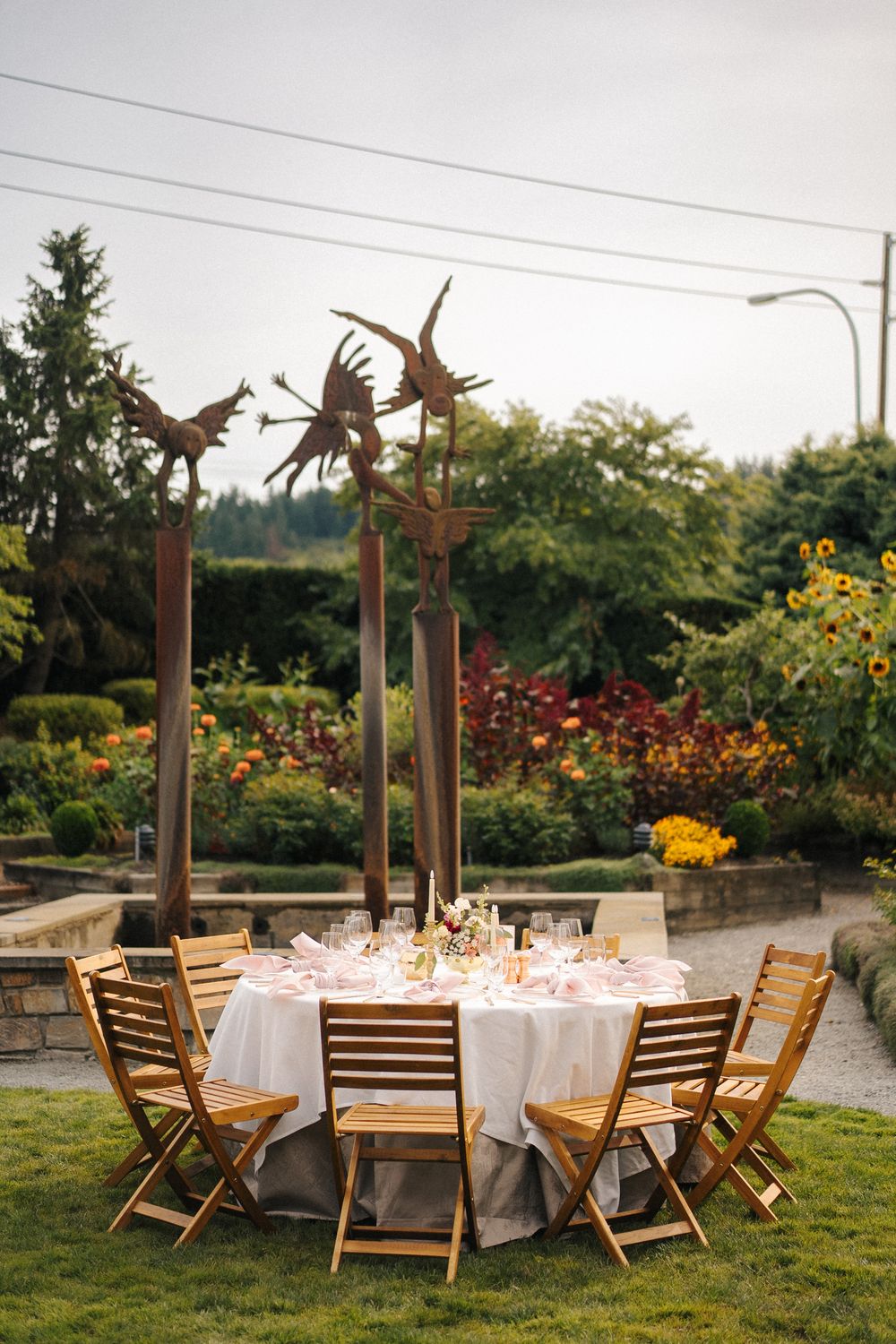Outdoor wedding reception tables with florals at Willows Lodge in Woodinville.