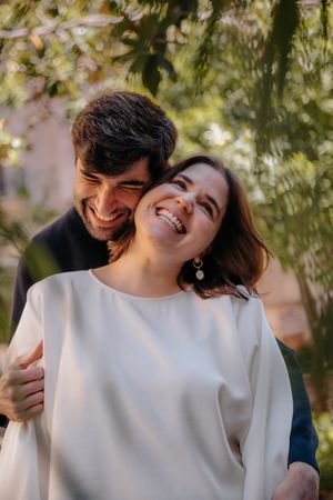 Relaxed couple enjoying a quiet stroll in Jardin Julio Munoz, a private oasis away from Barcelona crowds