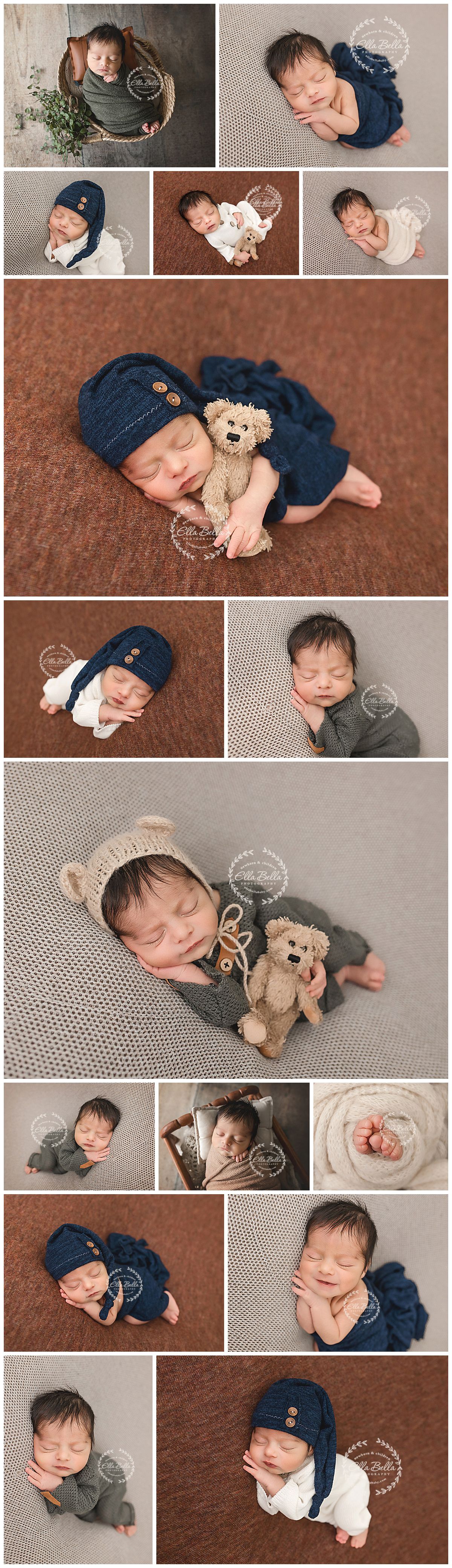 Sleeping newborn baby wearing a navy blue knit hat with buttons, wrapped in white, on a brown background.