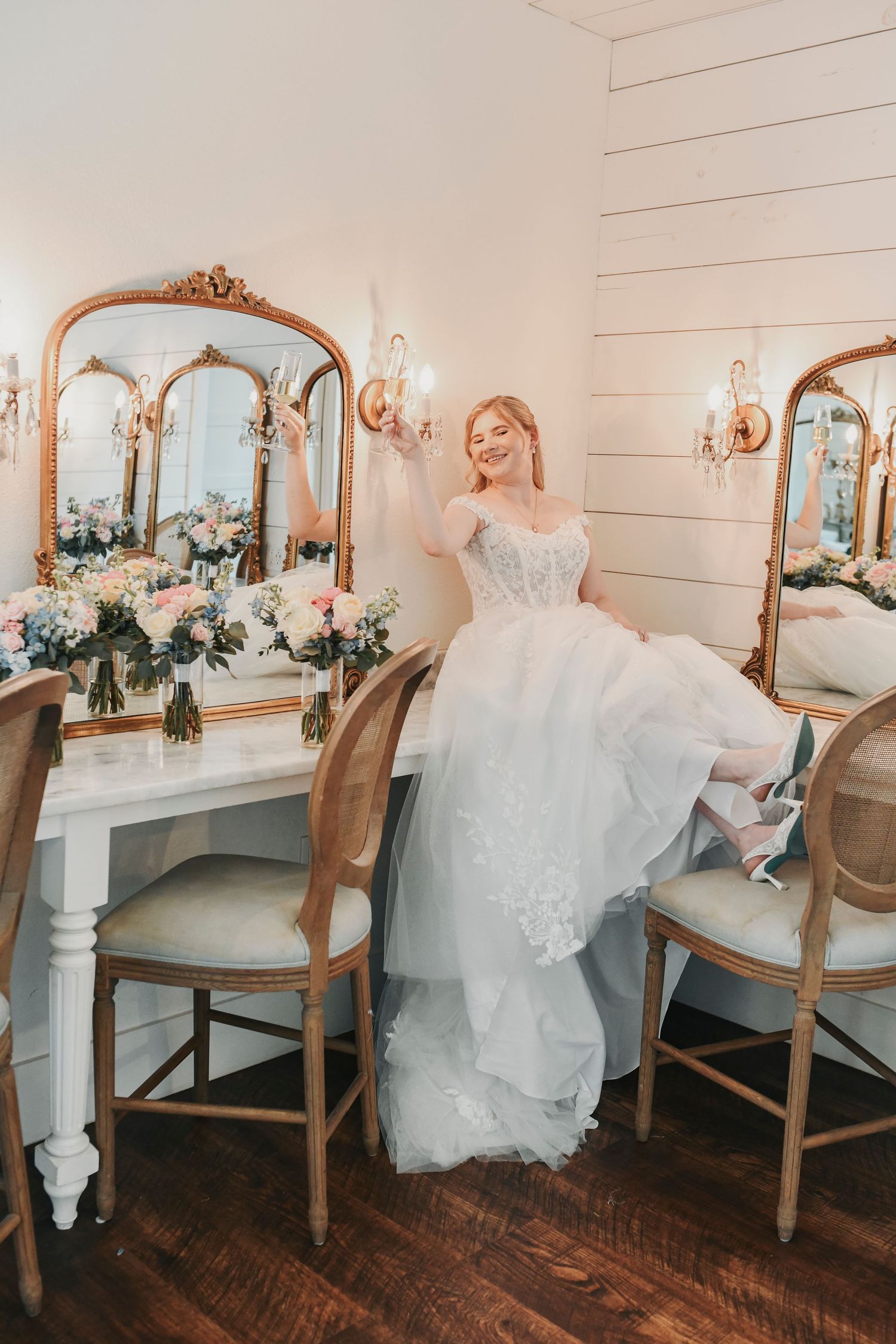 Fun bridal party champagne toast inside The French Farmhouse bridal suite