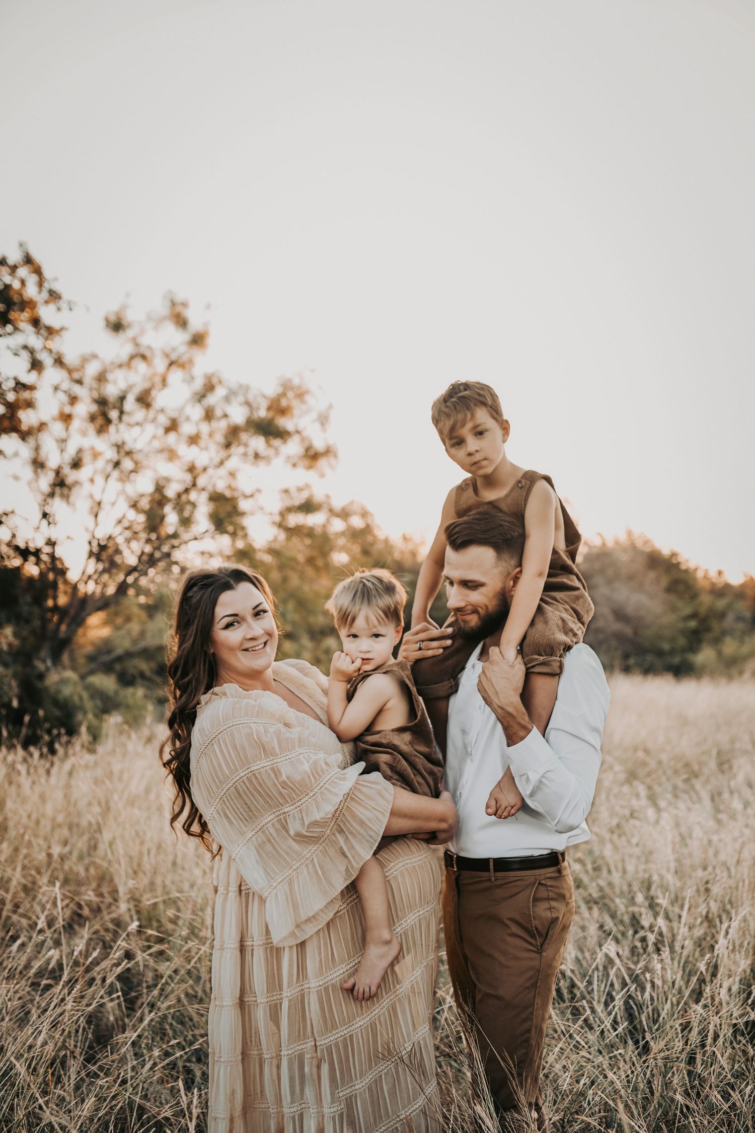 Candid maternity photography showing the joy and personality of a growing Dallas family