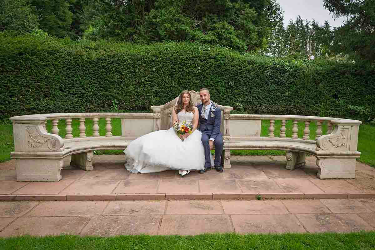 bride & groom pose for candid wedding photos at Dalston Hall