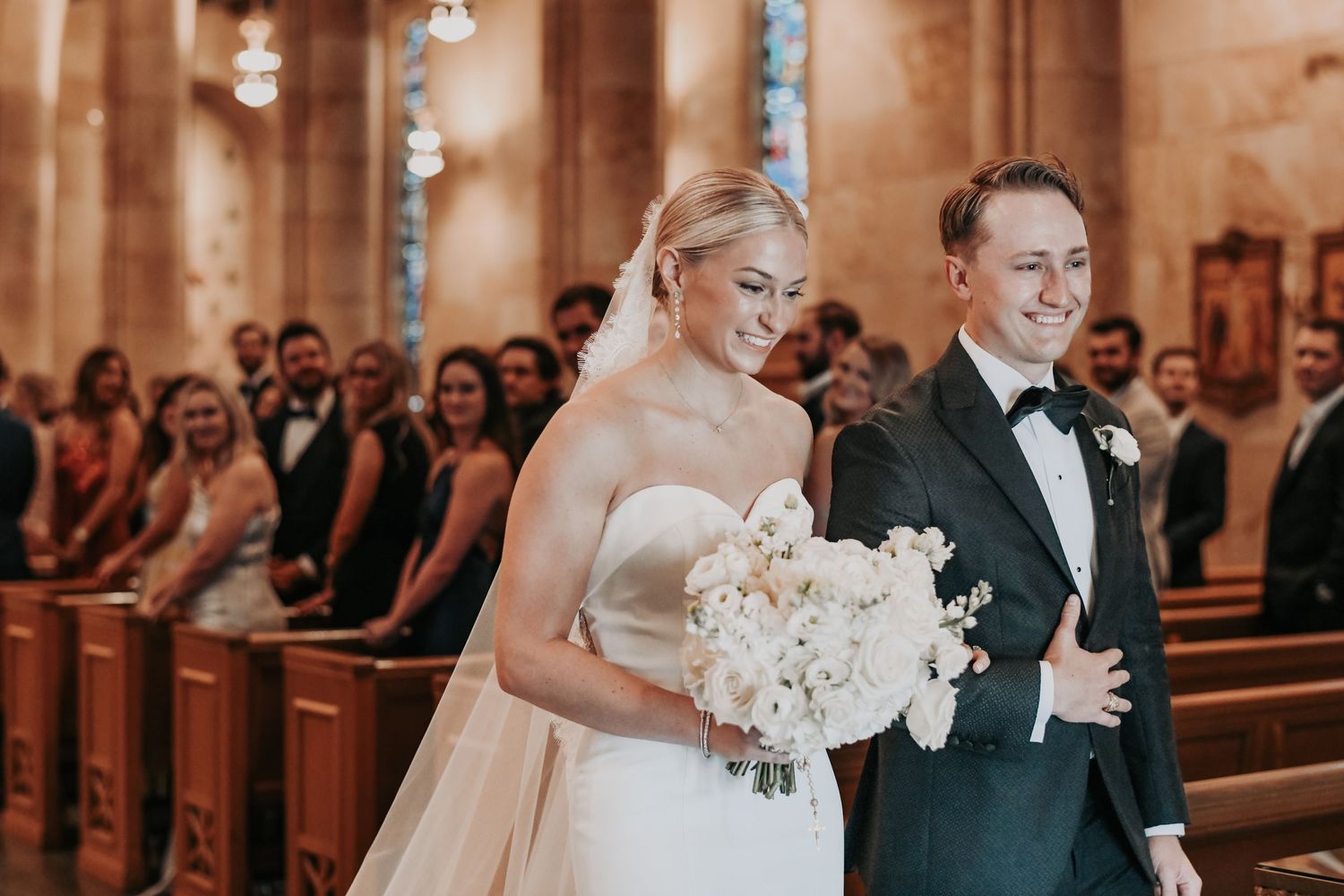 Newly married couple sharing a joyful moment at the altar