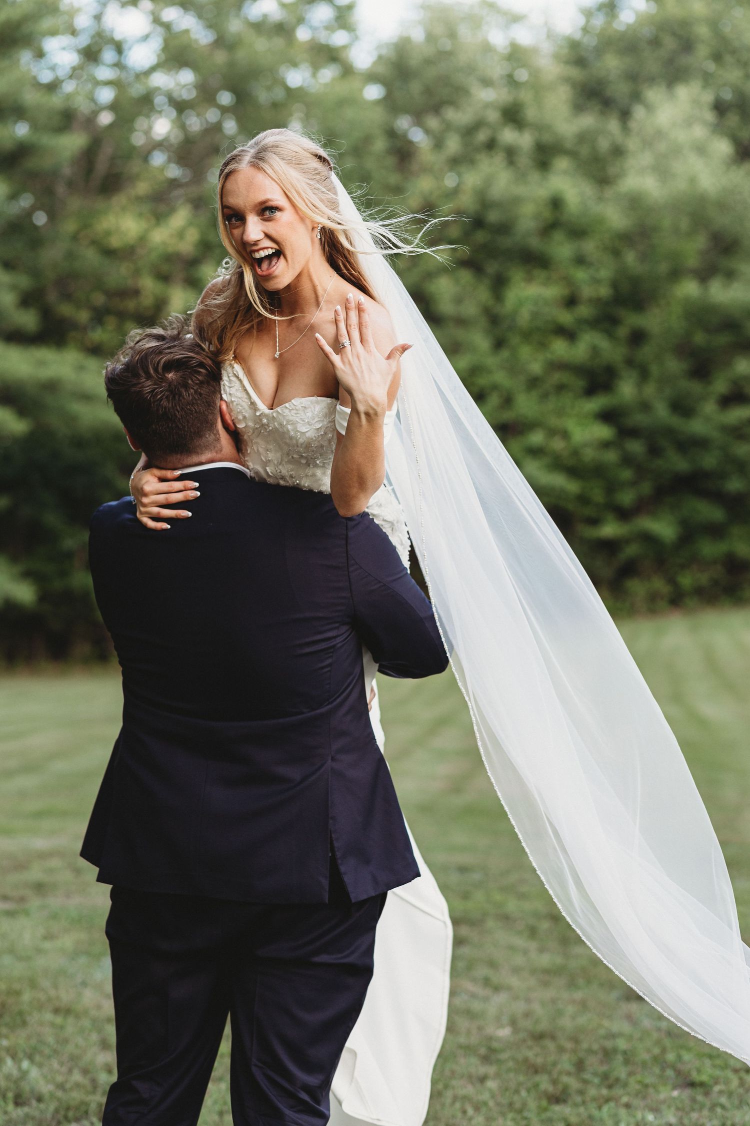 fun bridal couple photo during maine summer wedding taken by top rated maine wedding photographer