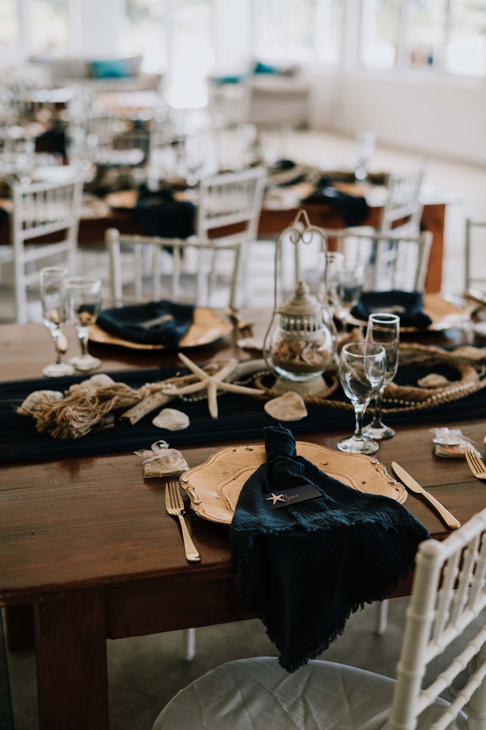 Ocean-inspired wedding décor in elegant shades of blue and gold at Gourikwa Reserve, featuring coastal details and sophisticated style