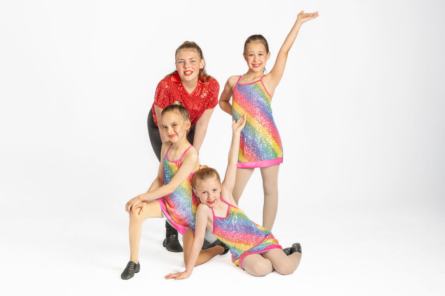 school age girl students of 3M dance Works in Port Hope wearing sparkle dance outfits for posed group shoot