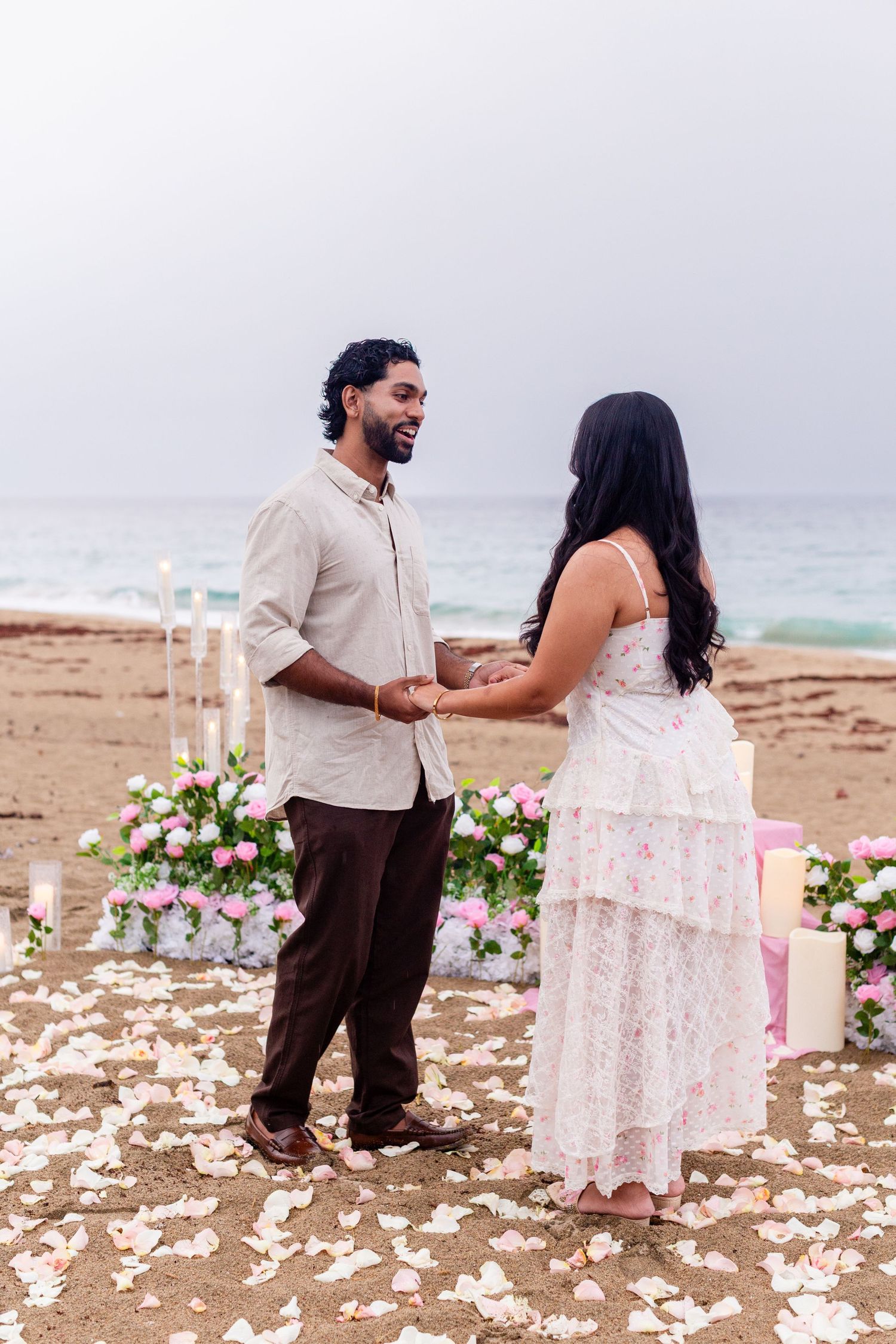 Marriage proposal on the beach with flowers and candles. Playa Guajataca, Isabela, Puerto Rico.