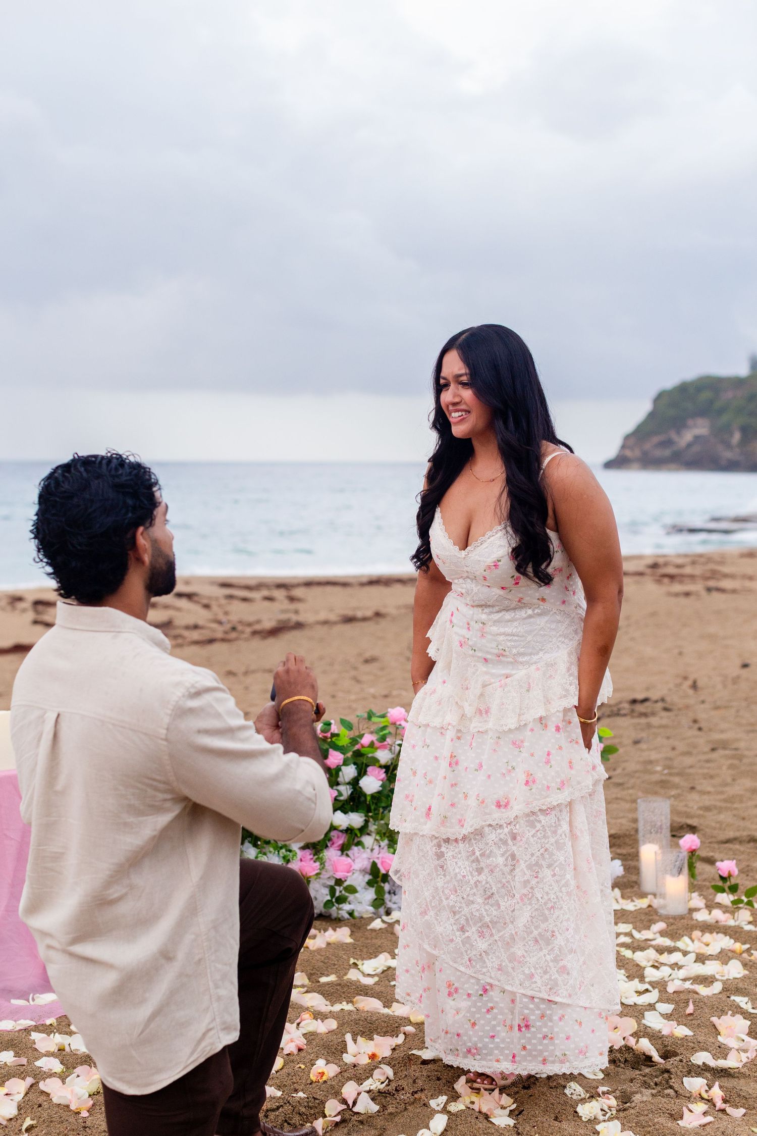 Marriage proposal on the beach with flowers and candles. Playa Guajataca, Isabela, Puerto Rico.