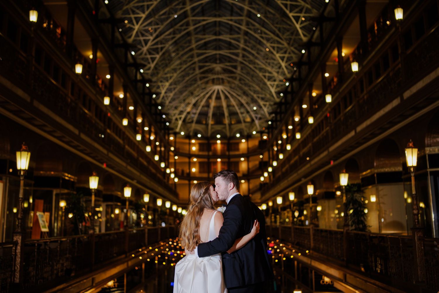 Bride and Groom kissing before going into their wedding reception at the Hyatt Regency Cleveland at The Arcade in Cleveland Ohio