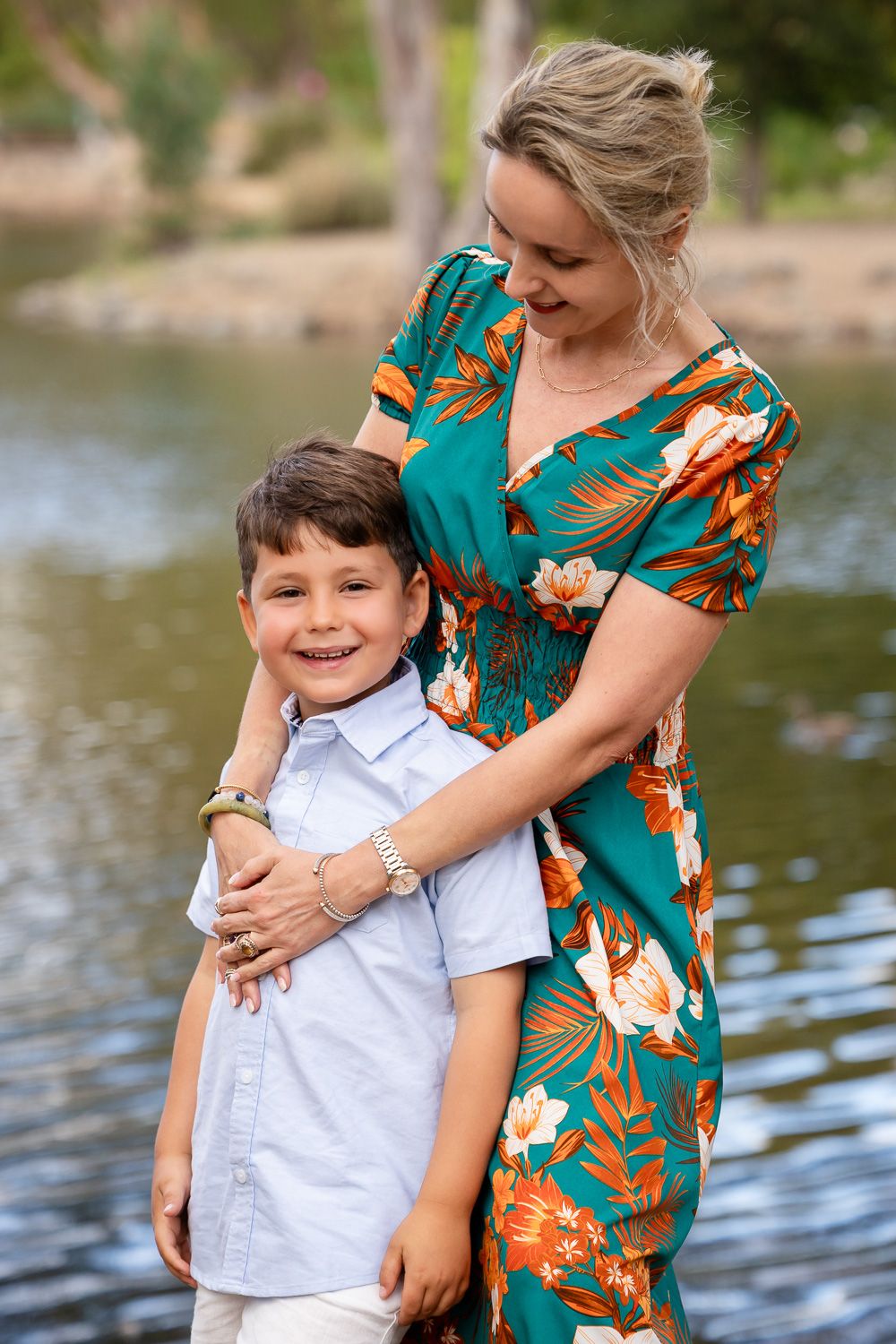 A mother looks at her young son who is smiling during their Los Gatos family photo session