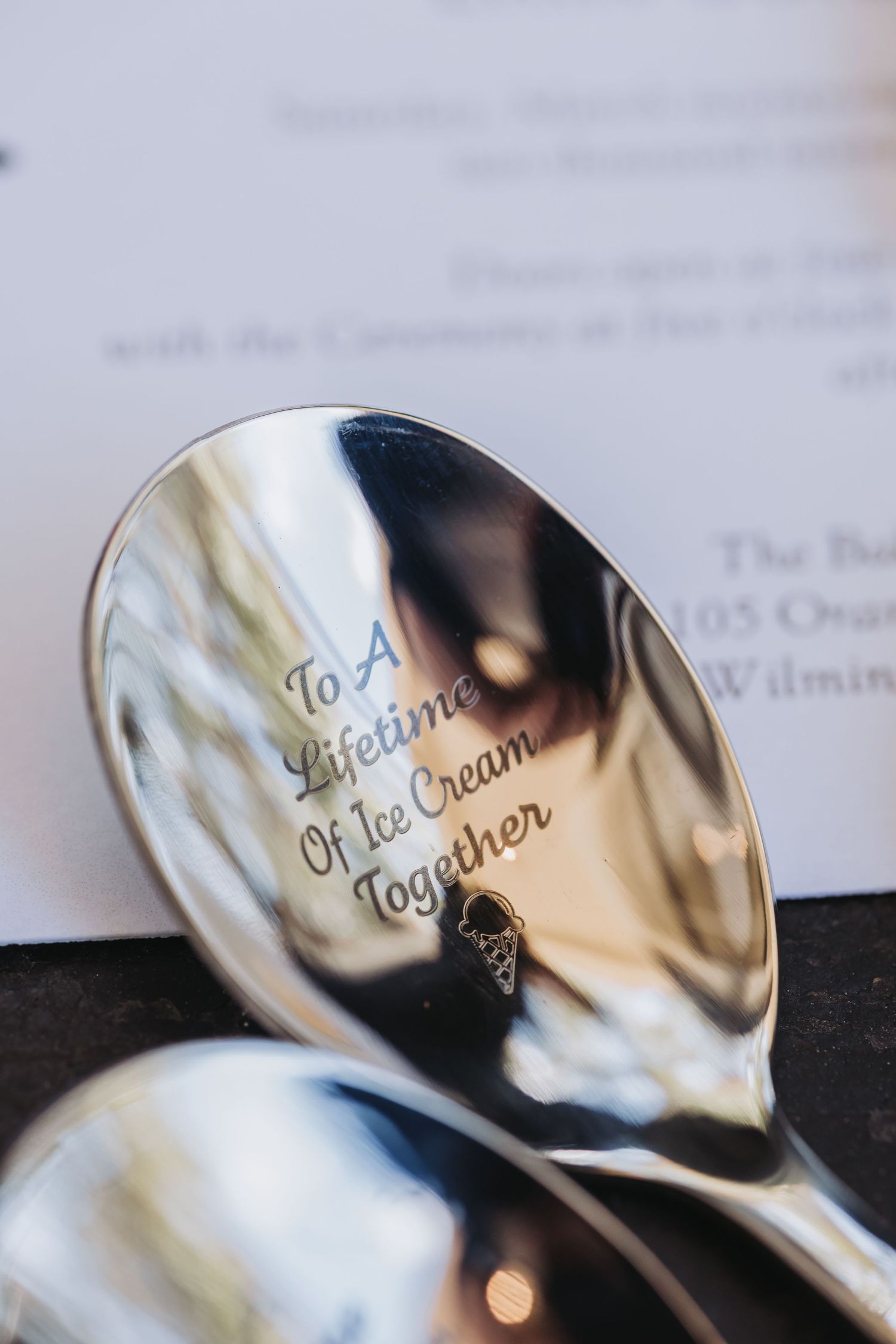 Engraved silver spoon reading 'To A Lifetime Of Ice Cream Together', a romantic wedding gift idea.