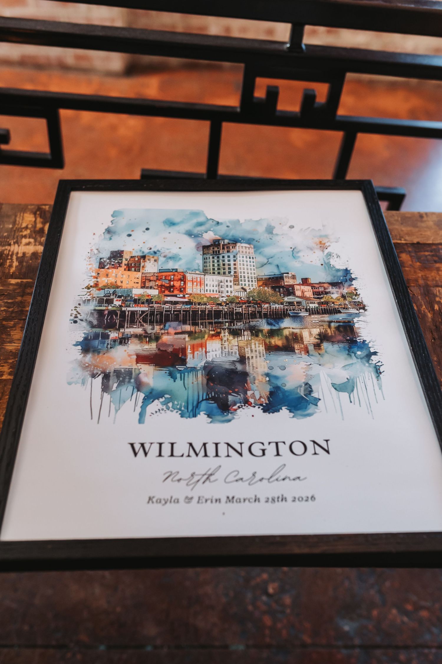 Framed watercolor art print of Wilmington North Carolina skyline personalized for Kayla and Erin wedding 2026.
