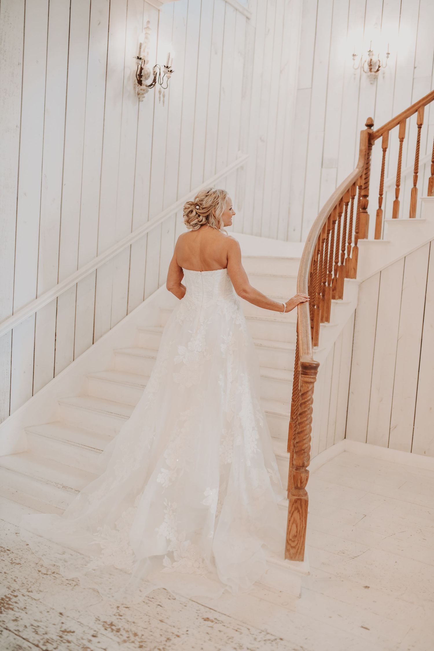 Bride photographed in soft natural light before her fall wedding ceremony