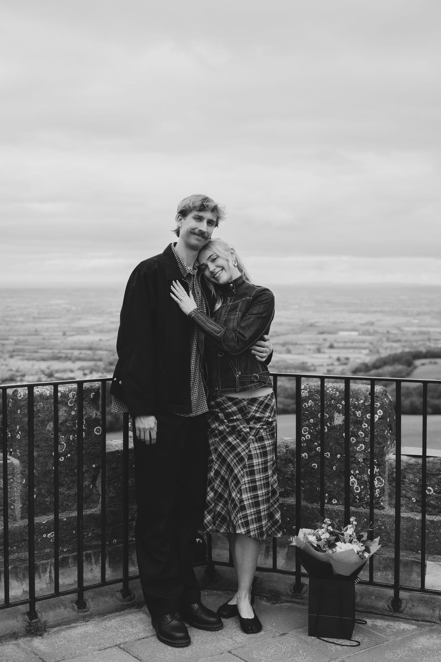 Couple celebrating after a Broadway Tower proposal.