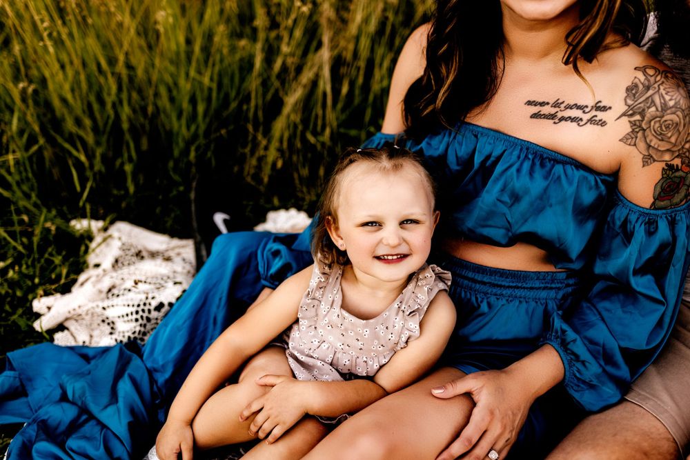 Maternity family session in Marion Indiana in a field