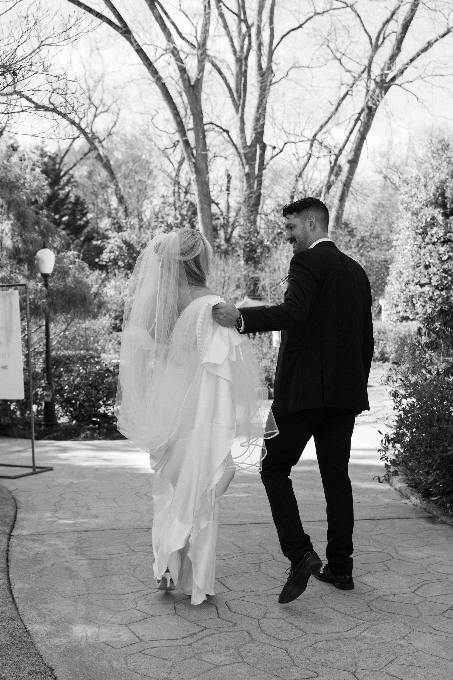 Bride and Groom walking during portraits at the Wildflower 301 in Greensboro, Georgia