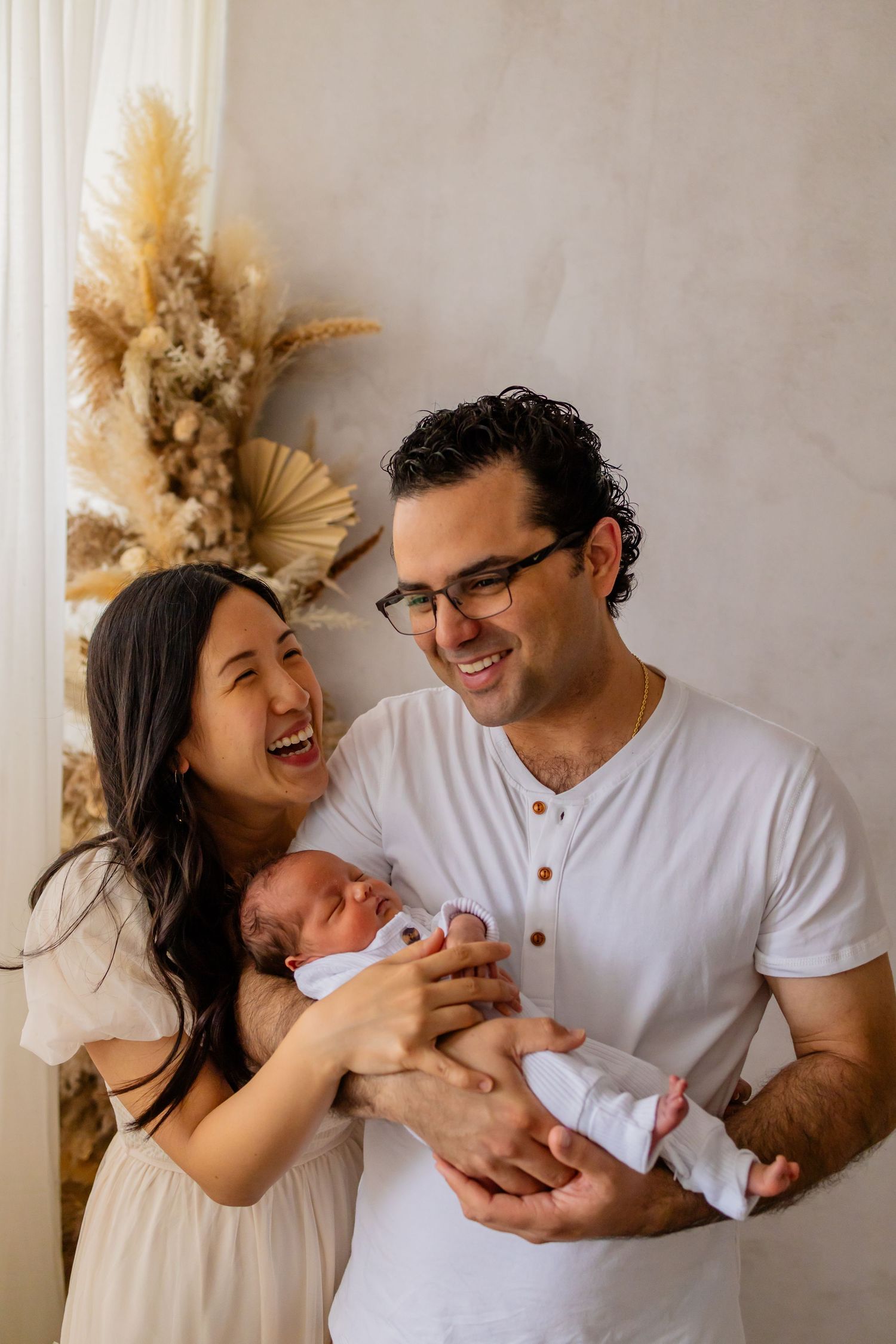 Couple holding newborn baby studio session NEPA photography