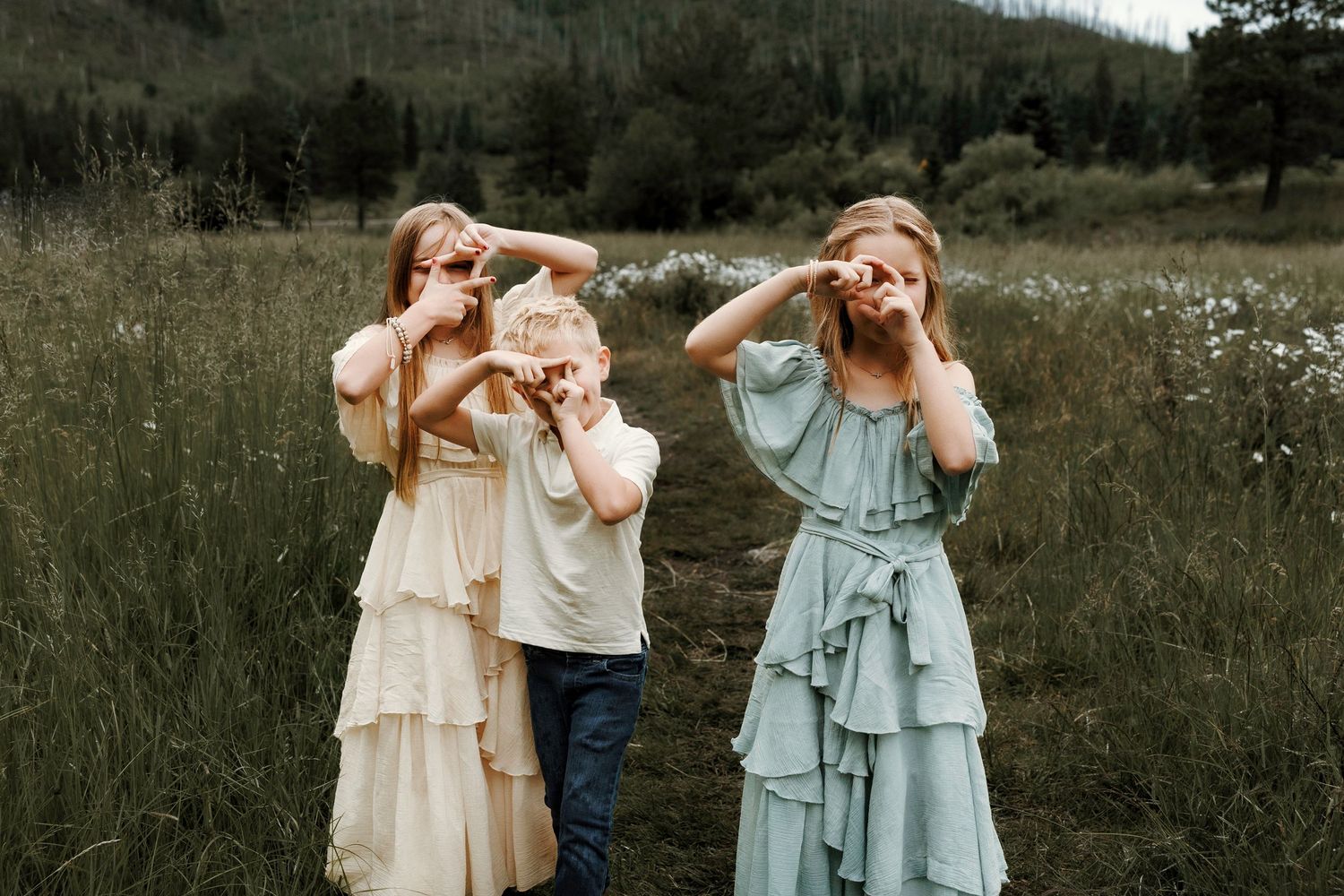 Albuquerque Family Photographer in green mountain wildflower field, candid playful moment
