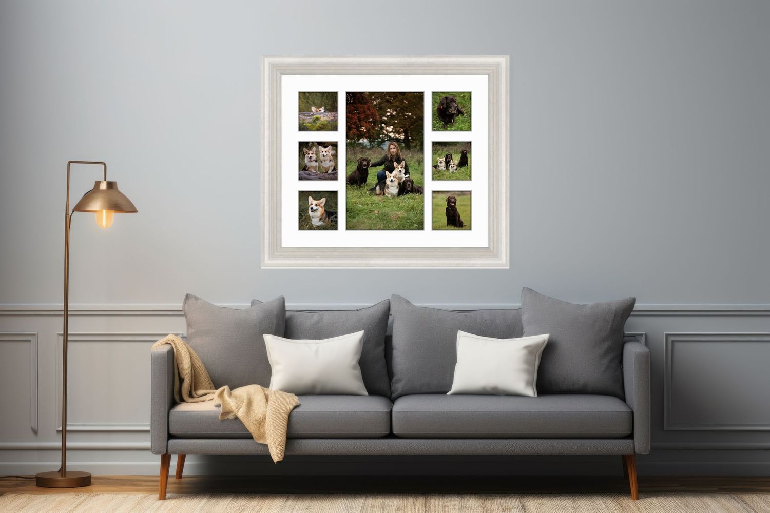Three framed family portraits arranged on wall above grey sofa with gold accent pillows.