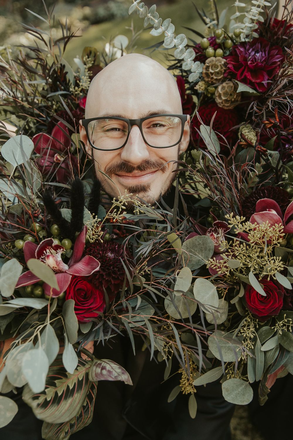 Close-up portrait of the groom in a tailored dark suit, captured by a Spokane wedding photographer