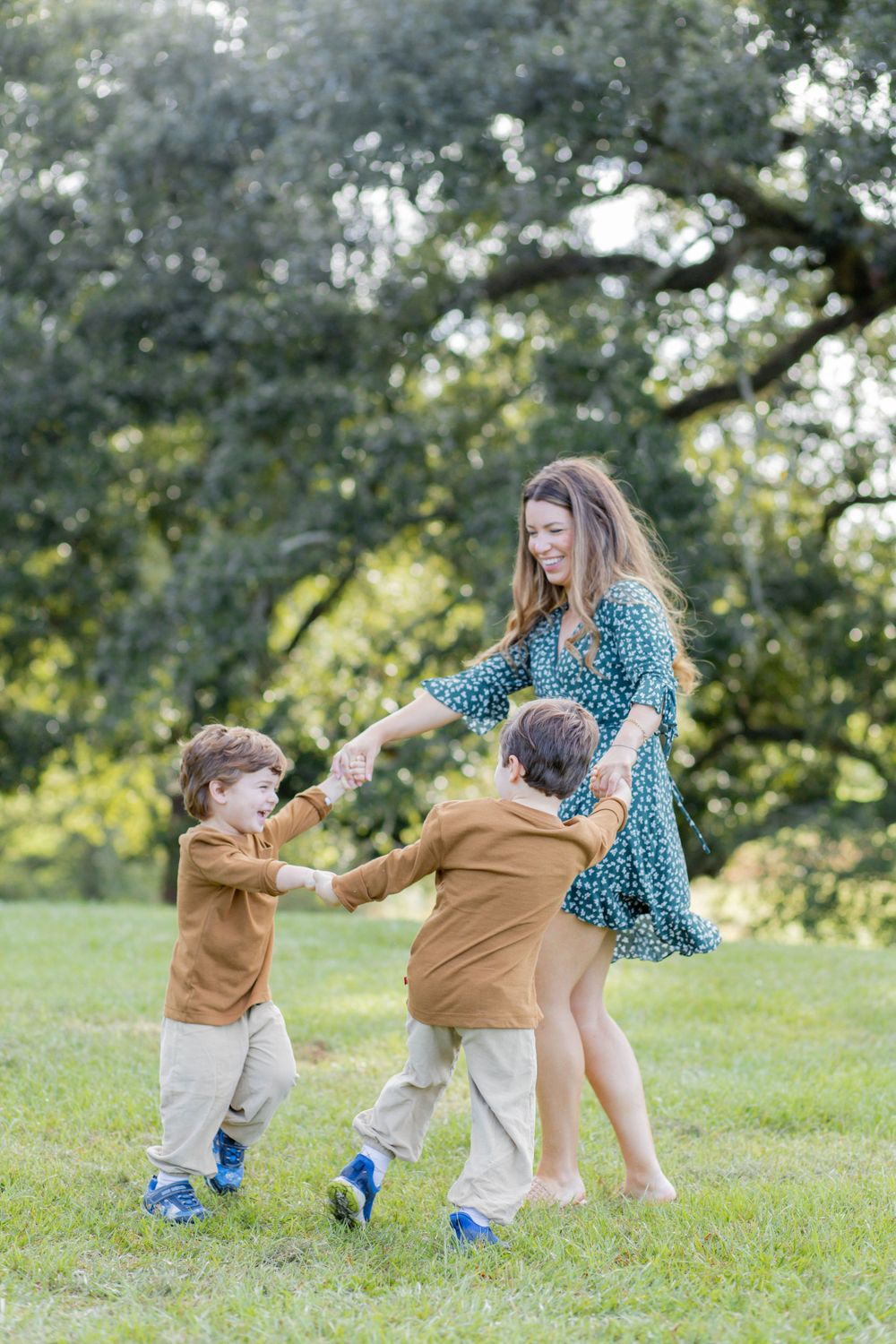 Dancing and playing ring-around-the-rosy in a sunlit park.