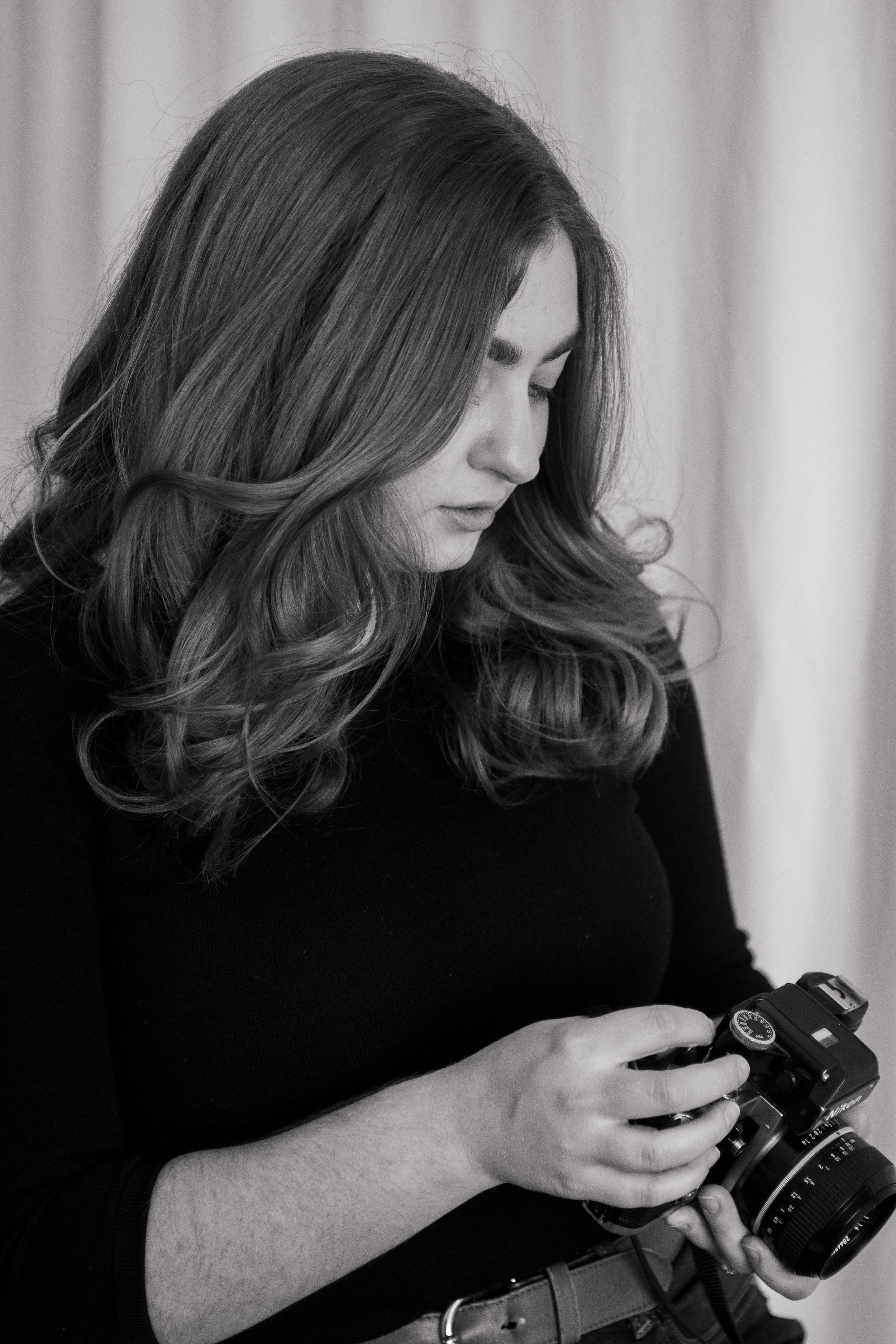 Utah Luxury wedding Photographer holding film camera.