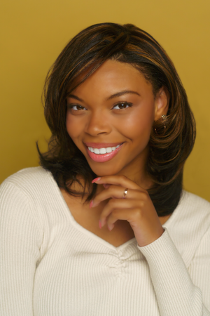A series of professional headshots showing a person in a white sweater against a golden background with various expressions.