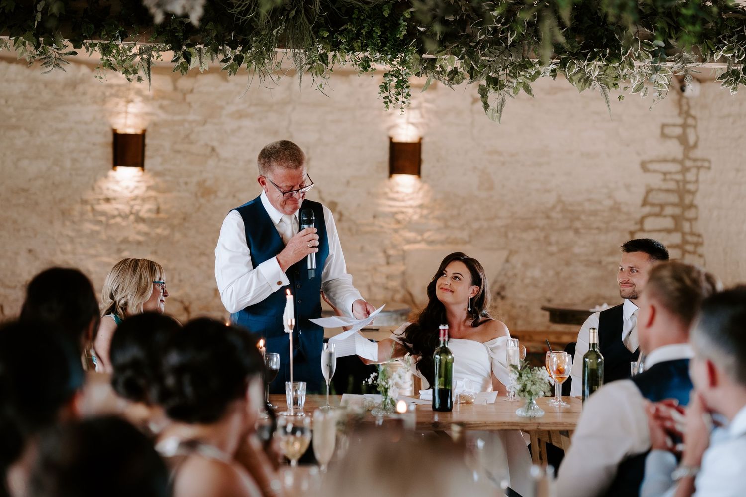 dad giving father of the bride speech during wedding breakfast at yardspace old gore cirencester