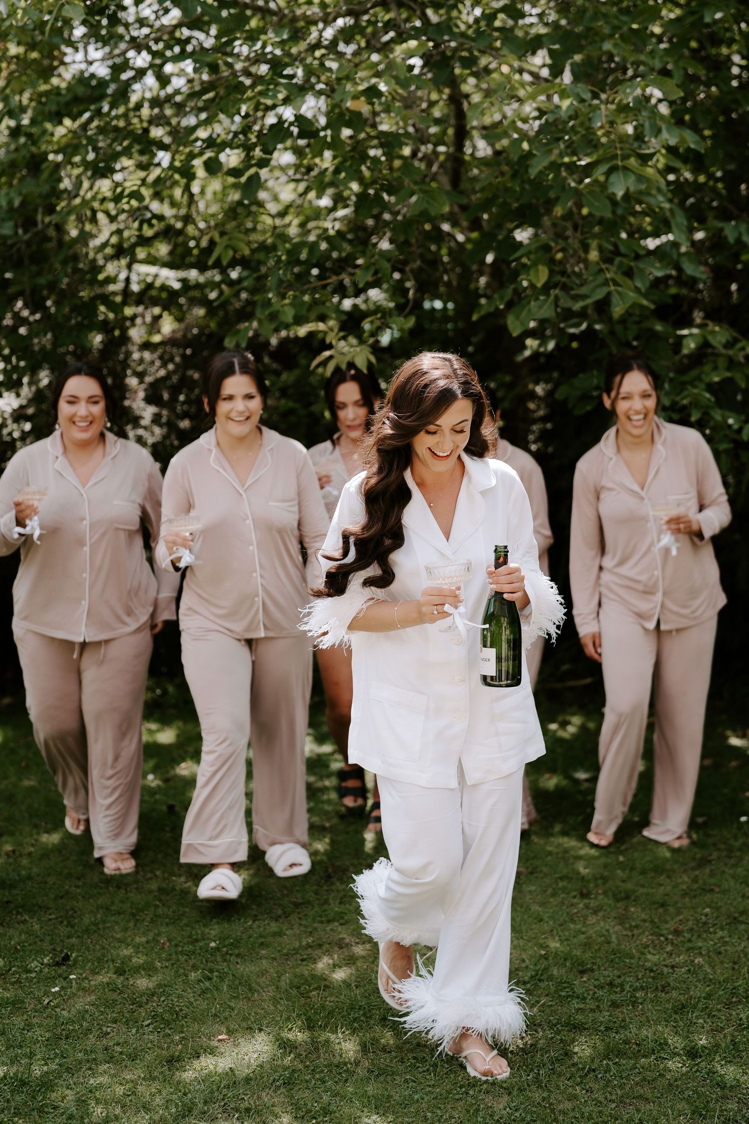 bride and bridesmaids with champagne at the new inn cirencester
