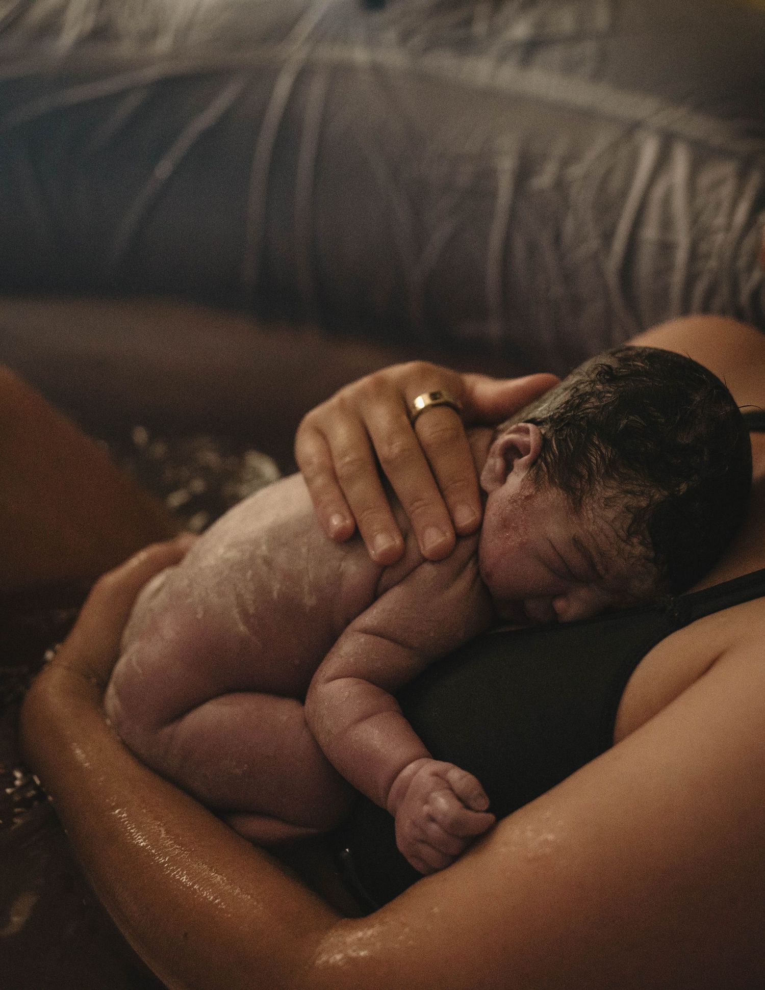 Intimate skin-to-skin contact with newborn baby after birth.