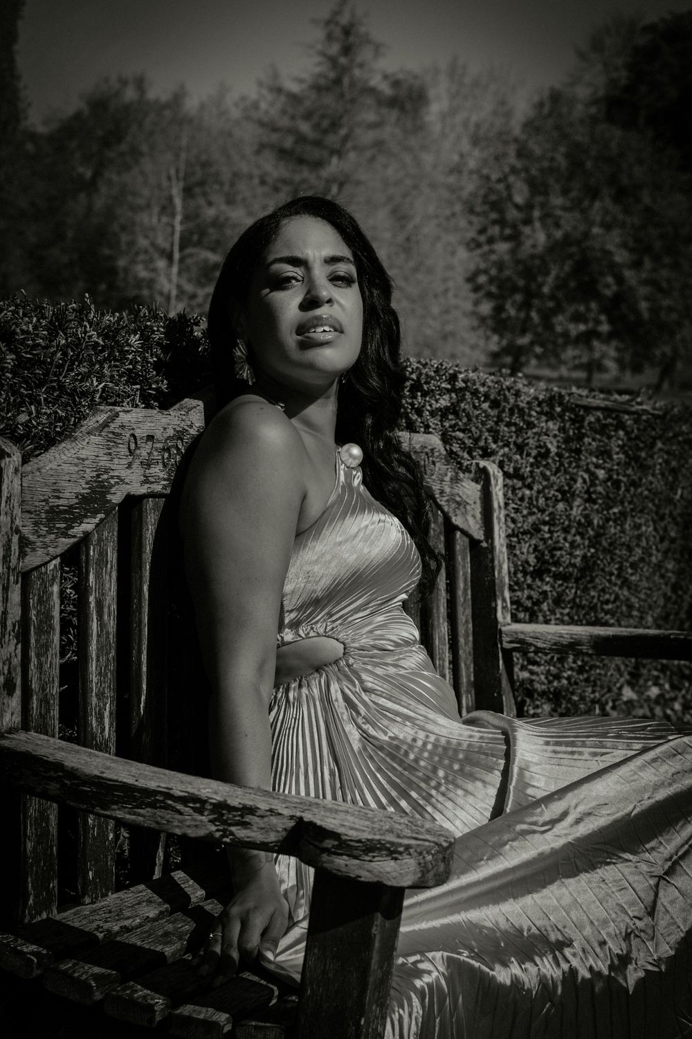 personal branding at the Christchurch mansion in Ipswich, woman sitting on a bench, monochrome, natural light, feminine, in her power