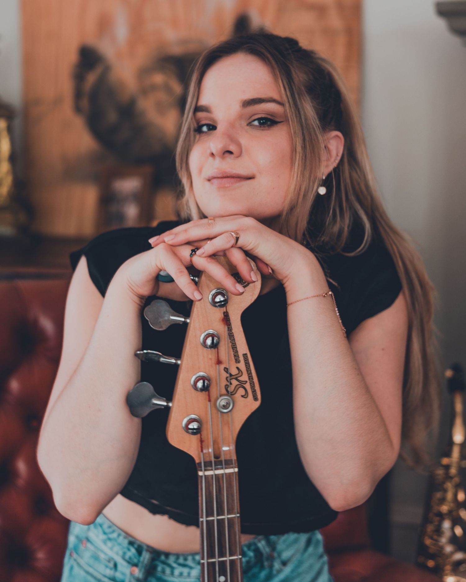 Casual portraits with a ukulele showing various relaxed poses in warm lighting.