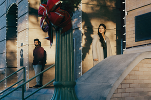 Newly wedded couple in morning sunlight in front of the Georgetown, TX courthouse for a photoshoot.