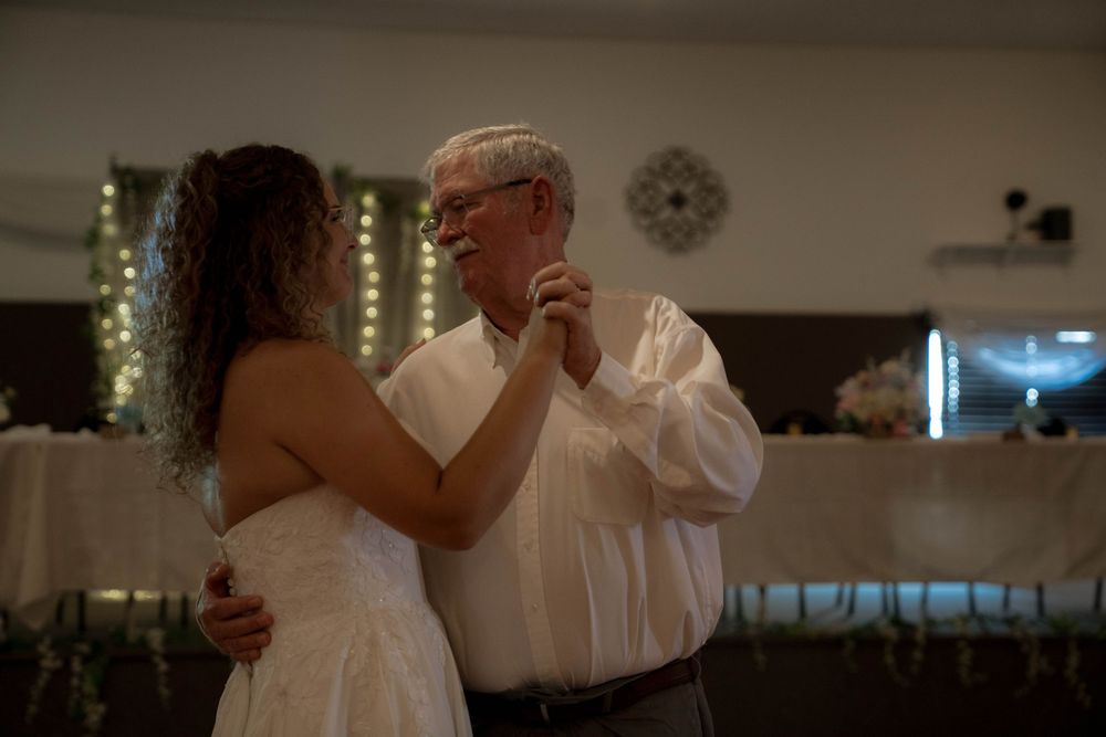 Couples dancing together during an intimate wedding reception.